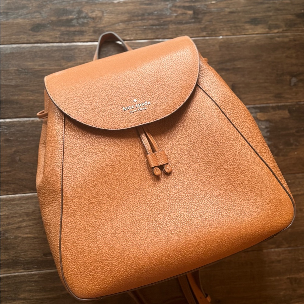 kate spade Pebbled Leather Drawstring Backpack in Cognac